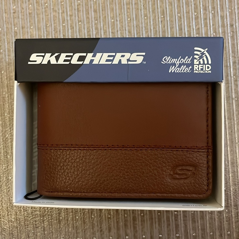 New in box. Sketchers slimfold wallet, cognac color.